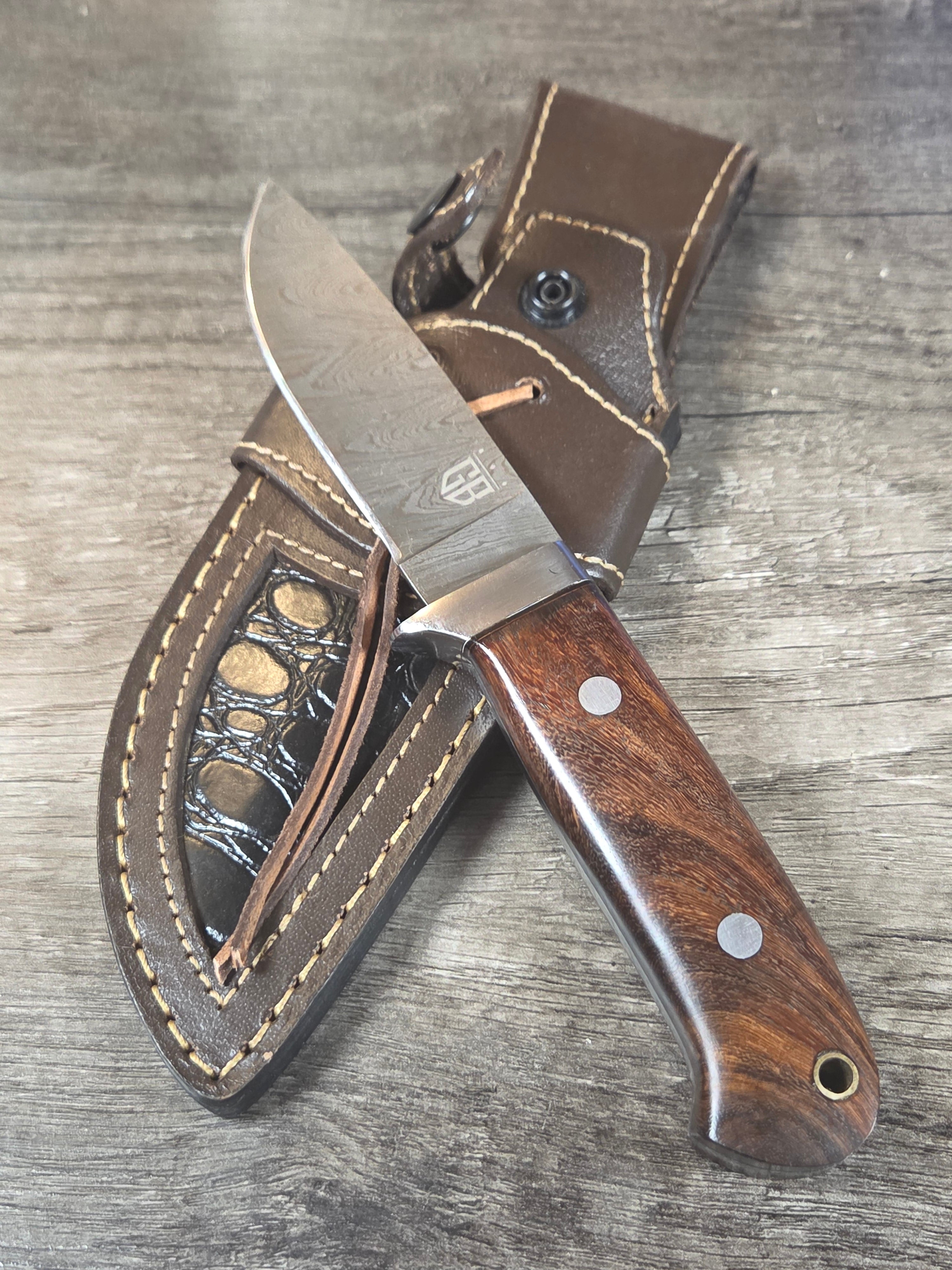 4" blade, 8" 1/4 overall length full tang, Damascus with Rosewood handle