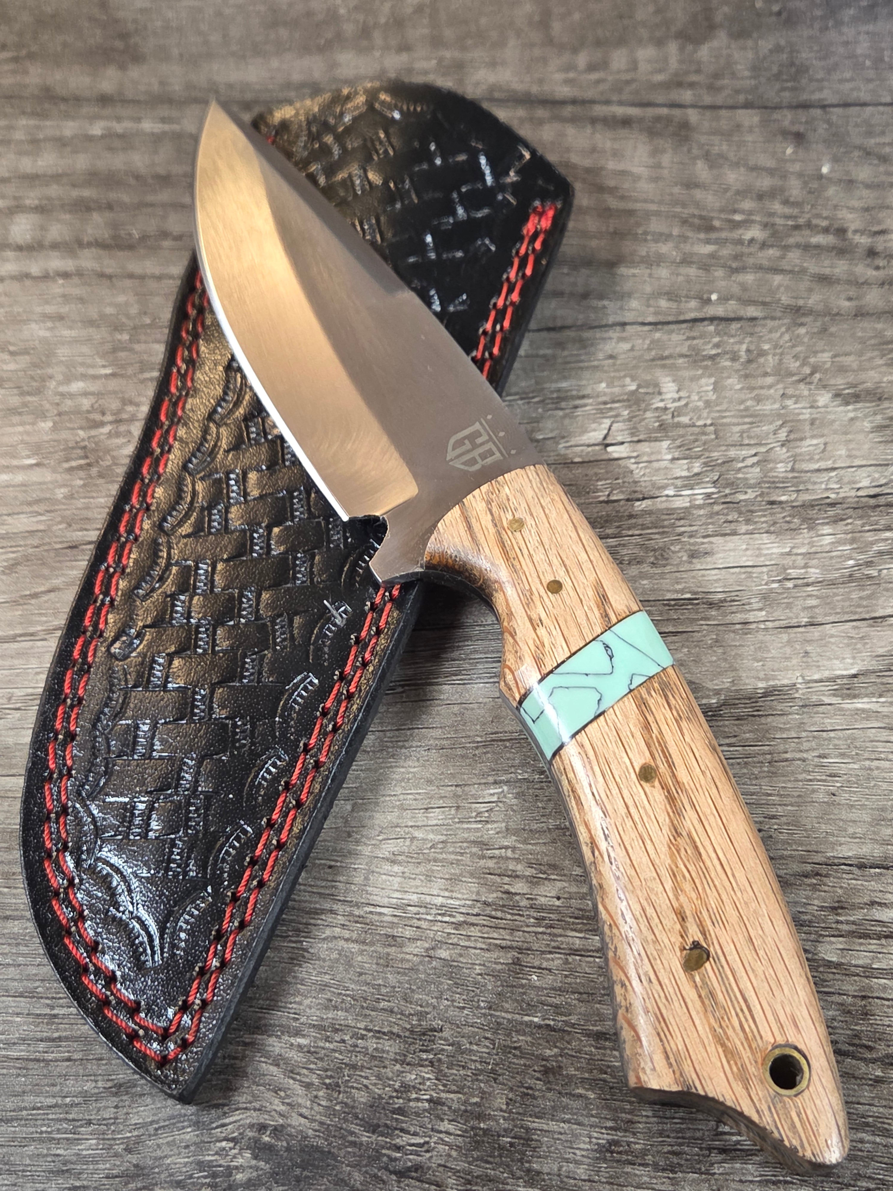 4" blade, 8" 1/2 overall length full tang, wood and turquoise stonework handle