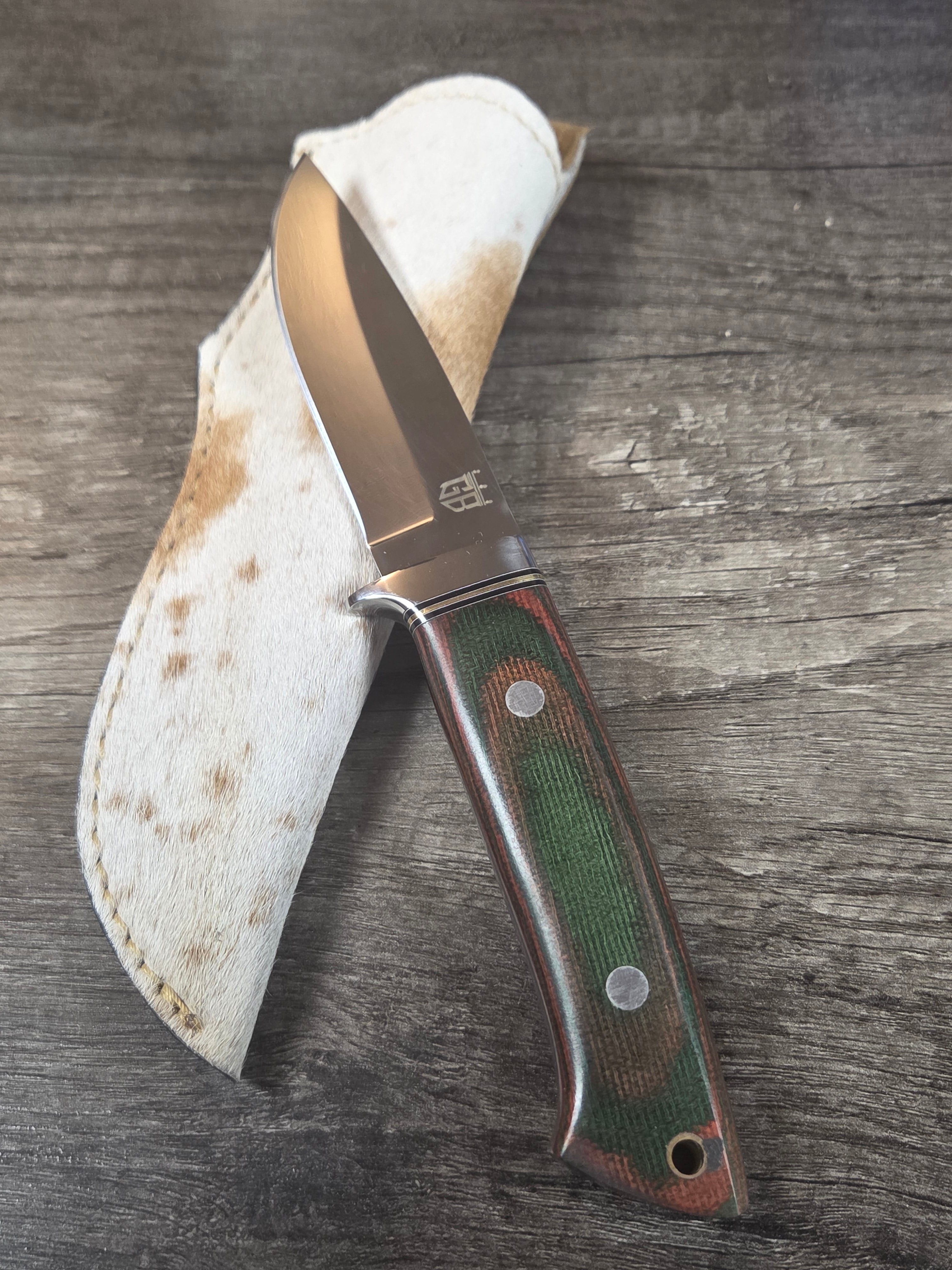 4" blade, 9" overall length full tang, micarta handle with goat hide sheath