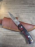 7" overall, 3" blade. Honeycomb black and red handle. Raindrop San mai Damascus blade